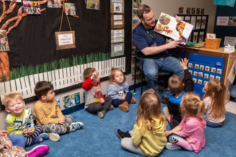 Teacher reading to students at Celebree School