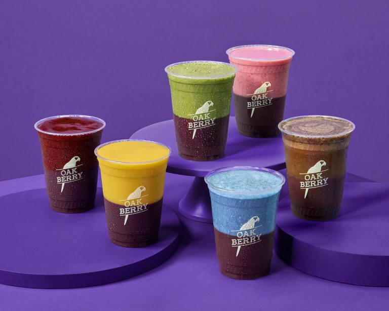 Image of six smoothies. Layer Up Smoothies at Oakberry Franchise