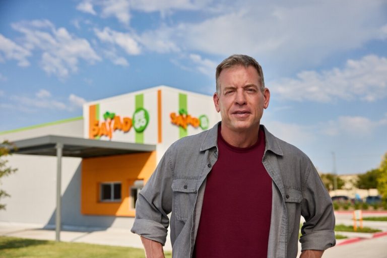 Photo of Troy Aikman in front of Salad and Go Chain Location