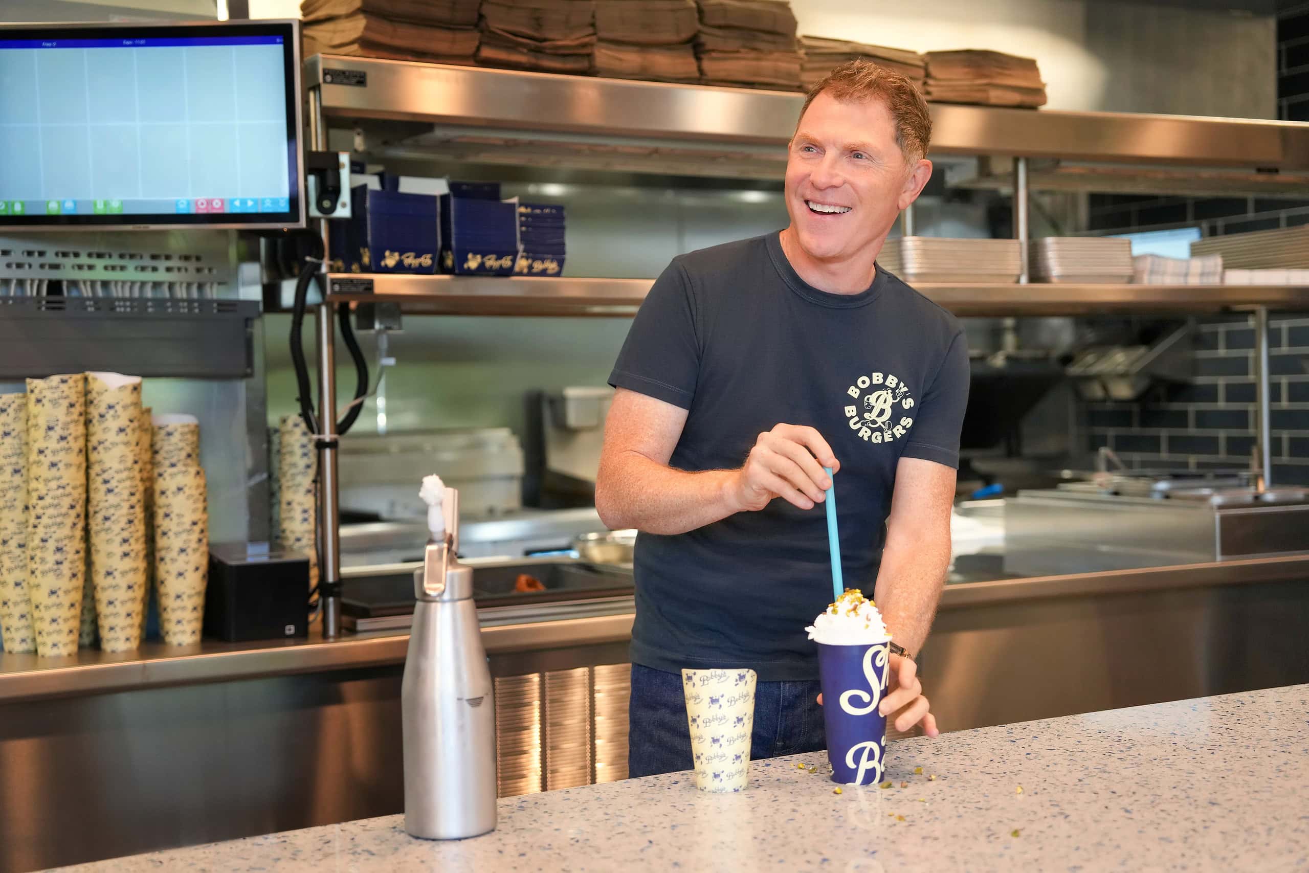 Bobby Flay mixing a shake at Charlotte Restaurant