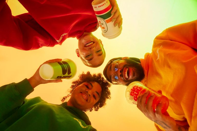 Image of 7-eleven patrons in old school clothing drinking Slurpees