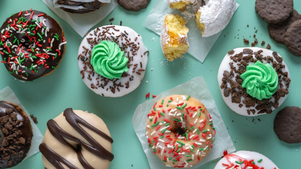 Image of girl scouts and Duck Donuts release of decadent donuts.