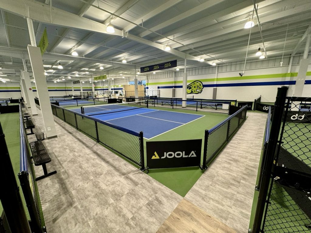 Pickleball in Maryland at PickleRage facility depicted in image. 