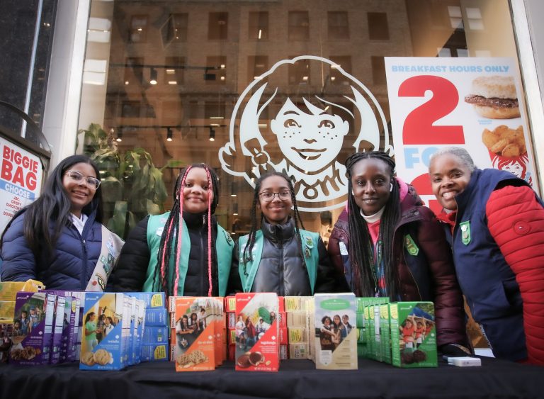 Girl Scouts at a booth outside of a Wendy's locaiton