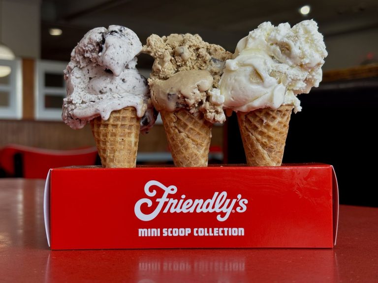 Three ice cream cones in a friendly box holder