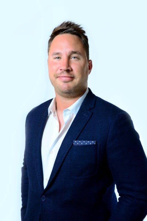Magnolia Bakery VP of U.S. Franchise Development & Sales Jason Mattes. In white dress shirt and blue sport coat
