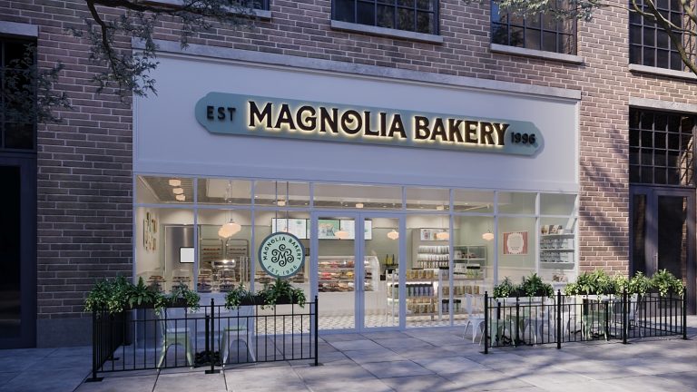 Magnolia Bakery Store Rendering. Semi Darkout lit sign that says Magnolia Bakery Bright inside with counter and baked goods displayed