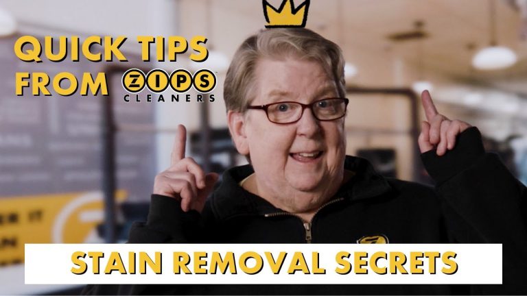 a person with glasses and a crown pointing up - this is the clean queen Kathleen Razmus of Zips