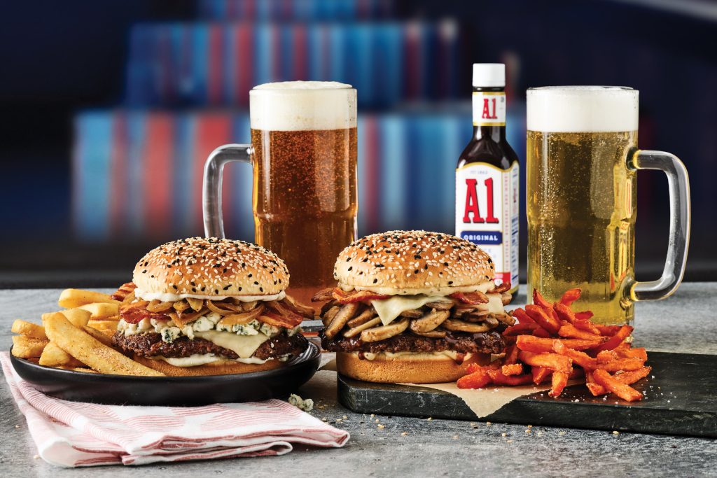 two burgers and two beers with A1 suace